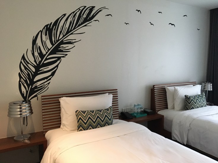 aviary hotel room bed decor 2