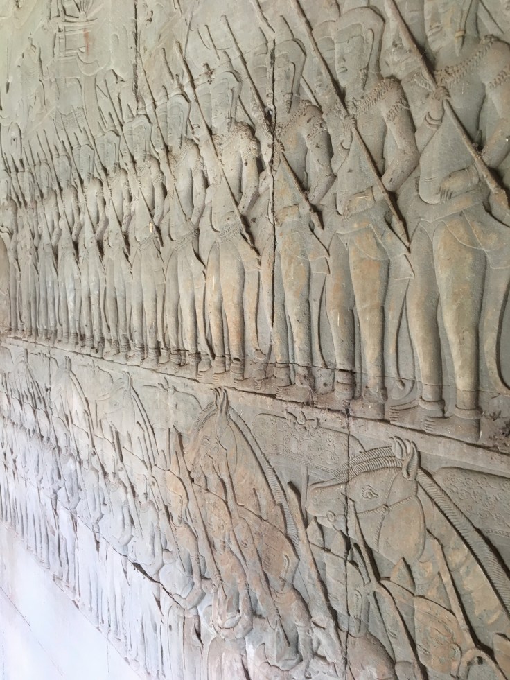 siem reap angkor wat temple battle stone carving