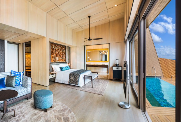 st regis maldives hotel overwater suite bedroom promo.jpg