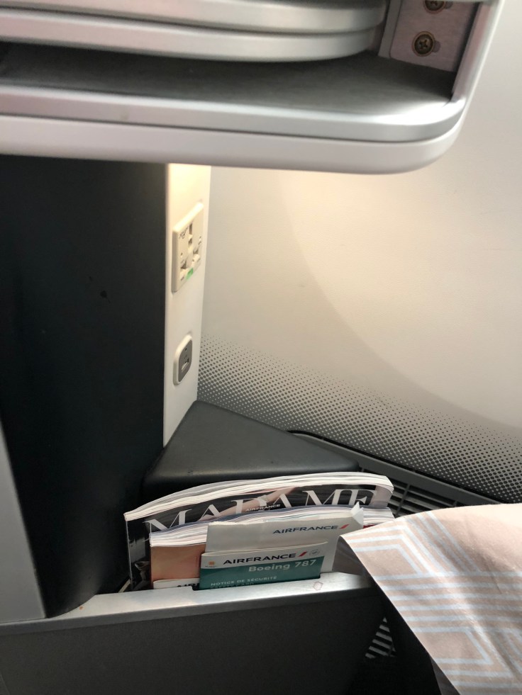 air france business hard seat power and literature nook