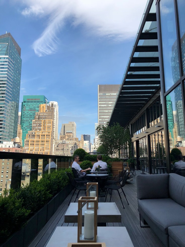 ac hotel new york times square public lounge terrace seat view