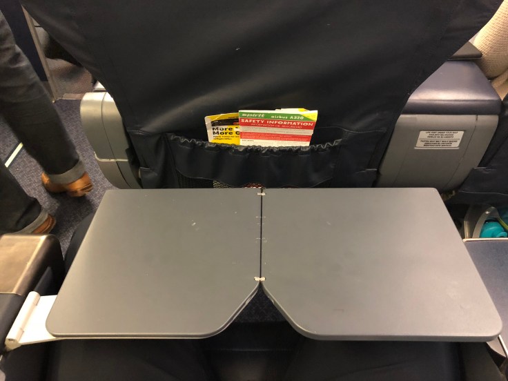 spirit airlines hard big front seat tray table extended