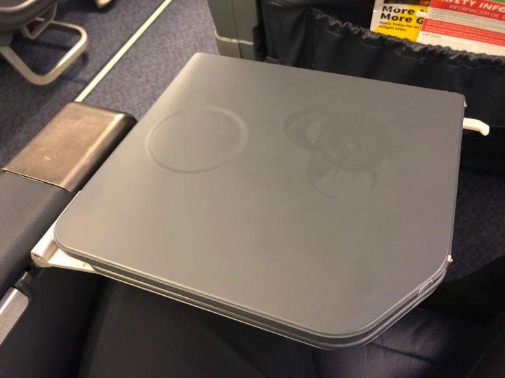 spirit airlines hard big front seat tray table folded