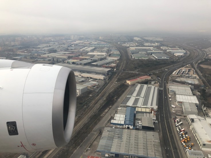 2019 iberia premium economy 08 on approach over industrial park